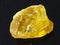 rough crystal of sulphur stone on dark background