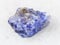 rough crystal of Tanzanite gemstone on white