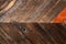 Rough diagonal wood background with knothole - vertical -natural colors with redish plank