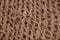 Rough fabric with huge network made from natural raw plant fiber. Detail, closeup. Horizontal. brown tone. Wallpaper and