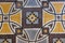 rough geometric pattern decorative pale multi color marble mosaic floor detail close up background