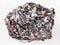 rough gneiss stone with corundum crystals on white
