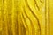 Rough gold texture background. Striped golden texture. Carving golden texture