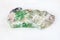 rough green Beryl gemstone on white