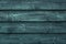 Rough green wooden boards. Weathered dark wood floor, barn, dilapidated fence. Hardwood texture grunge wall background.