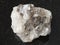 Rough Halite rock salt stone on dark