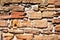 Rough hewn wall of weathered sandstone blocks