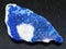 rough lazurite (lapis lazuli) stone on dark