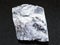 rough magnesite stone on dark background