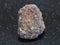 rough magnetite (iron ore) stone on dark