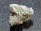 rough Malachite (copper ore) stone on dark