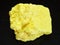 rough native Sulphur stone on dark background