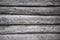 Rough old weathered log cabin background wall closeup