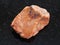 rough orthoclase stone on dark background