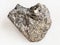rough peridotite stone with phlogopite on white