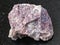 Rough pink Dolomite stone on dark background