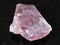 rough pink Flint stone (Chalcedony) on black