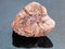 rough pink Granite stone on dark background