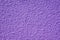 Rough purple bulge concrete wall background, texture