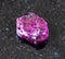 rough Rhodolite (pyrope garnet) crystal on black