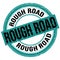 ROUGH ROAD text written on blue-black round stamp sign