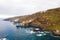 Rough rocky cliffs in the North of Tenerife.Black beach in the Canary Islands. Rocks, volcanic rocks, Atlantic ocean