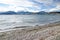 The Rough sand beach with snowy mountain view on a cloudy day at South Island, New Zealand.