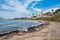 The rough sandy beach with holiday apartment blocks in the background, Cyprus