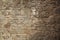 Rough sandy texture of an old medieval stone wall. Background for design, close-up, copy space