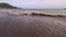 Rough sea on the shoreline in the bay at twilight.