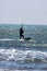 Rough sea and the strong wind are ideal conditions for athlete who practices  practices kitesurfing sports