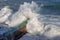 Rough Sea Waves Crashing Over a Pier, mediterranean sea, ligurian coast, Italy.