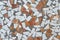 Rough simple mosaic of split tiles in white and orange shades, texture background