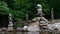 Rough Stone Cairns Standing Proudly in the Shallow Creek Water