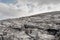 Rough stone terrain in Burren National park, county Clare, Ireland. Cloudy sky