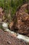 Rough stormy river in red rocky mountains