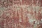 Rough textured background red old cement wall with