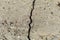 Rough textured surface of cracked concrete foundation slab