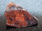 rough Wolframite in stone on dark