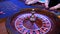Roulette wheel running in a casino, Poker Chips.Classic casino roulette wheel