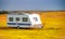 Roulotte on the countryside of Iceland, summer season, white caravan in autumn season