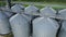 Round aluminum granaries. Large silver bins for processing grains