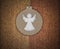 Round angel pendant on brown cashmere textile background