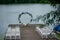 Round arch with white and blue flowers. Check-out on the river or lake.Wedding registration.