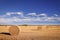 Round bails of hay in a farmers field