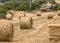A round bale of straw for animal feed. Forage for livestock. Natural agricultural landscape of Cyprus