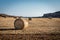 Round bales of hay in the field on Cyprus coastline in Cape Greco area.