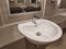 Round bathroom washing sink on marble stone surface