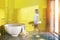 Round bathtub yellow bathroom interior toned