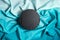 round black stone tile on silky blue gradient background. Product photography mockup